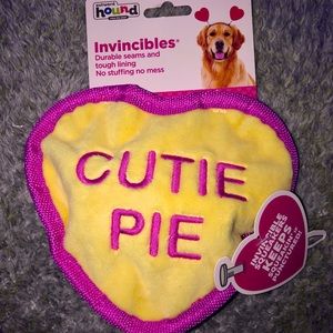 Adorable squeaky heart-shaped dog toy.